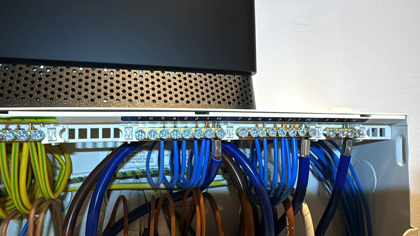 Neatly run and terminated circuit cables inside a new consumer unit