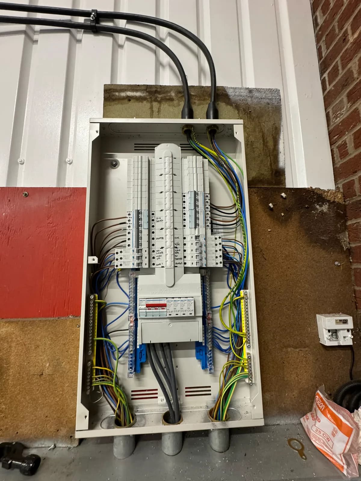 Three-phase distribution board with labelled, neatly terminated circuits