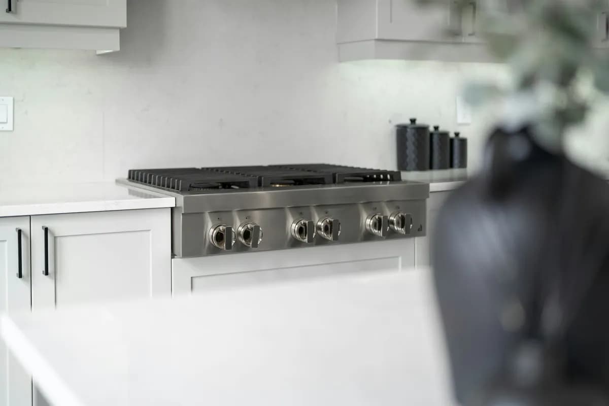 Range cooker set into a bright modern kitchen