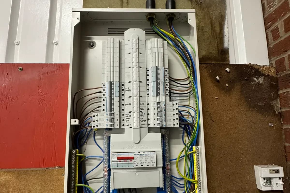 Three-phase distribution board opened up for inspection on a London job