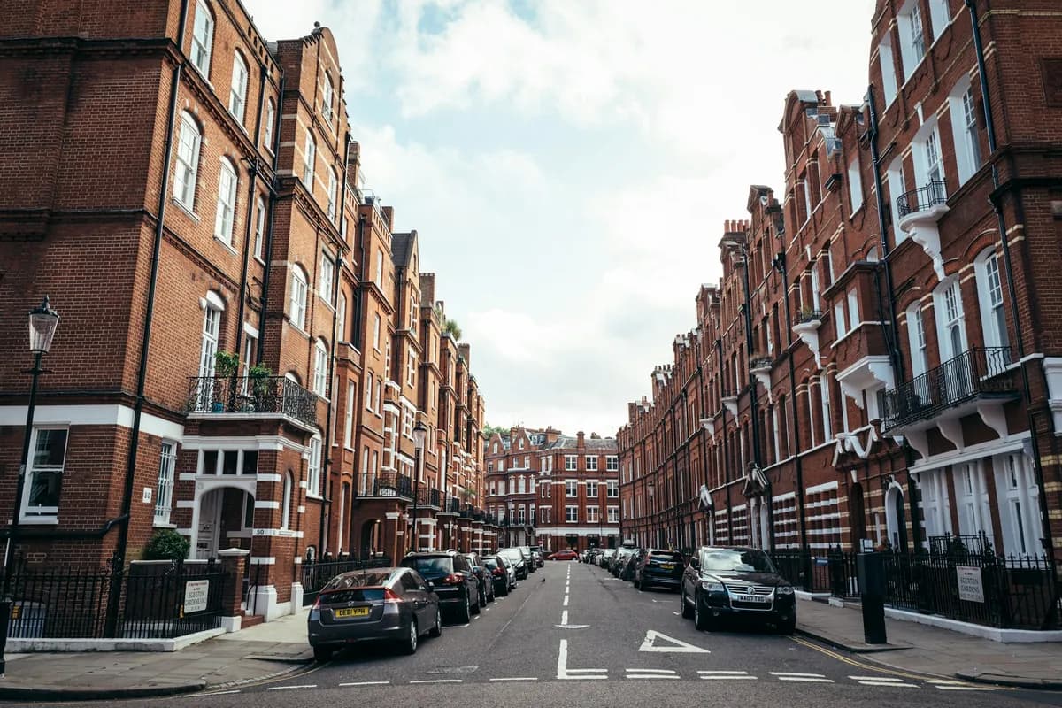 Red brick mansion blocks on a residential London street