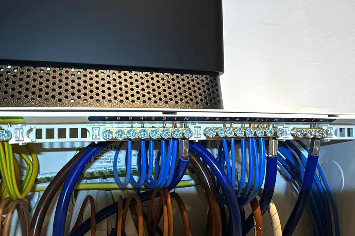 New cables dressed neatly into a board during a rewire