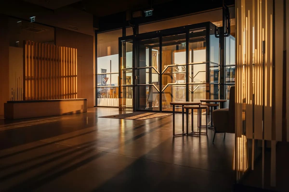 Glass entrance doors into a commercial building lobby